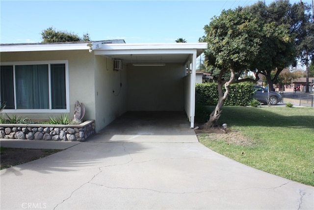 exterior space with a carport, a wall unit AC, and a front lawn