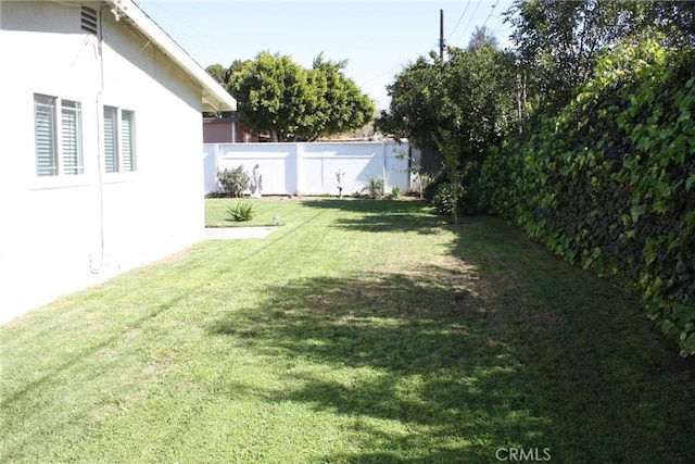 view of yard featuring a fenced backyard