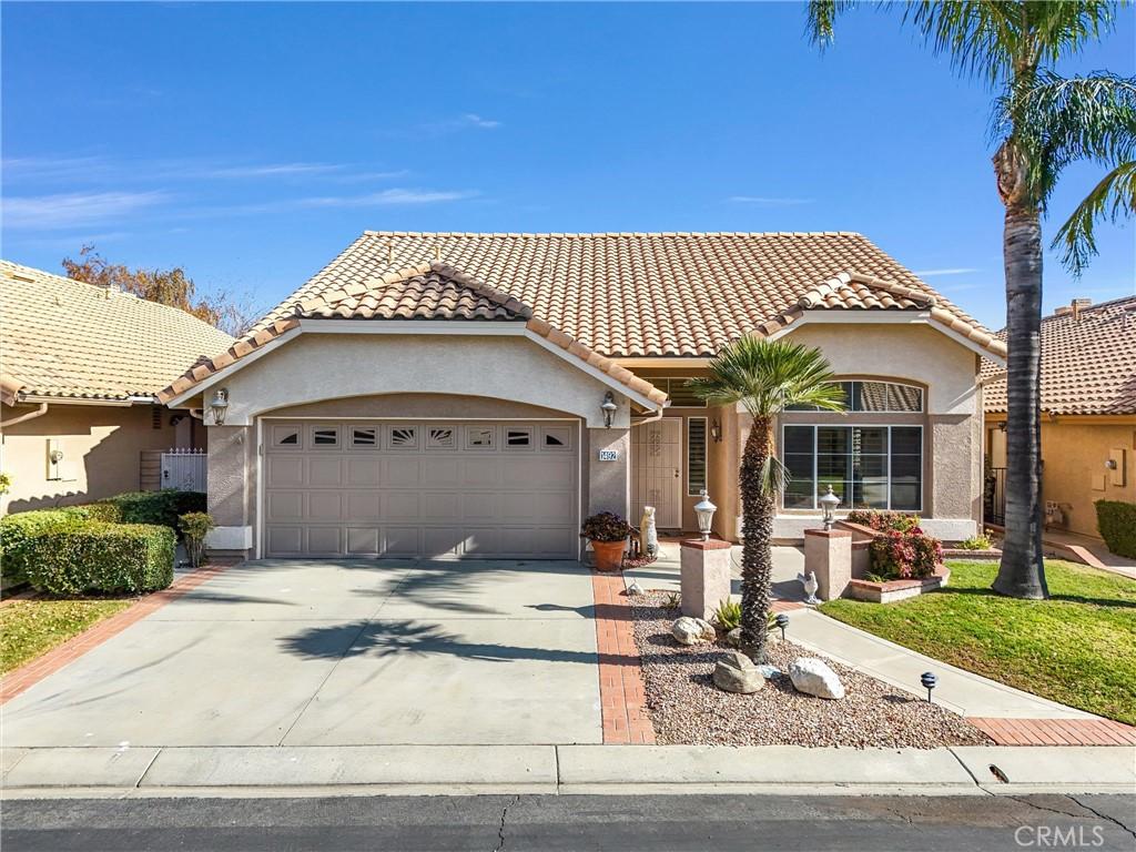 mediterranean / spanish-style home featuring a garage