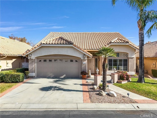 mediterranean / spanish-style home featuring a garage