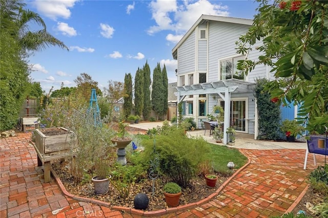 exterior space with a pergola and a patio