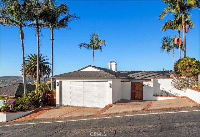 single story home with a garage