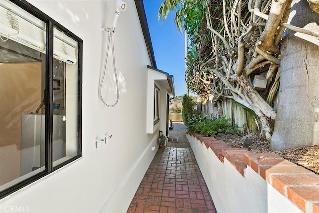 view of property exterior with a patio