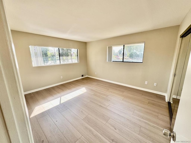 empty room featuring light hardwood / wood-style floors