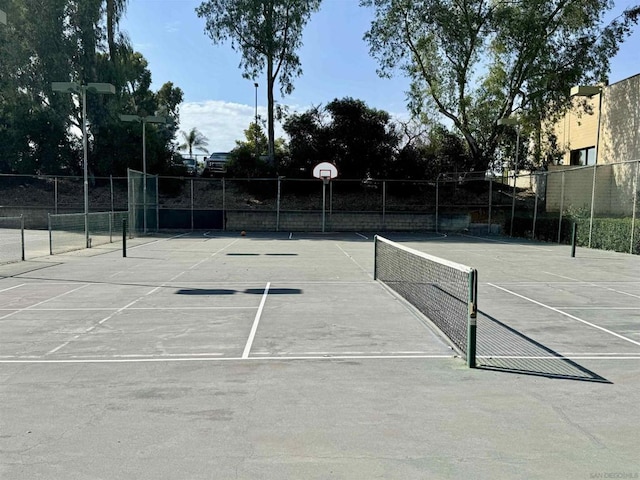 view of tennis court with basketball court