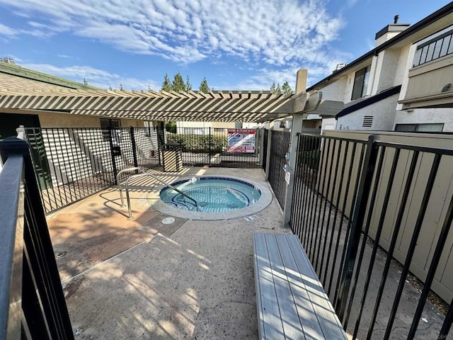 view of swimming pool with a community hot tub