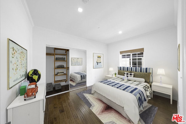 bedroom featuring crown molding, a closet, and dark hardwood / wood-style floors