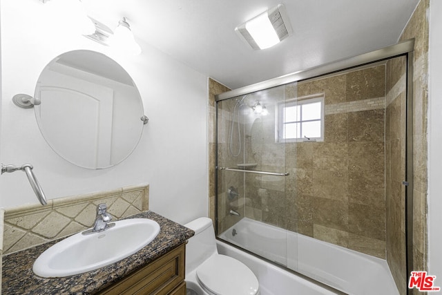 full bathroom with backsplash, vanity, enclosed tub / shower combo, and toilet