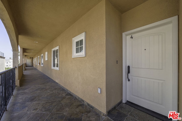 entrance to property with a balcony