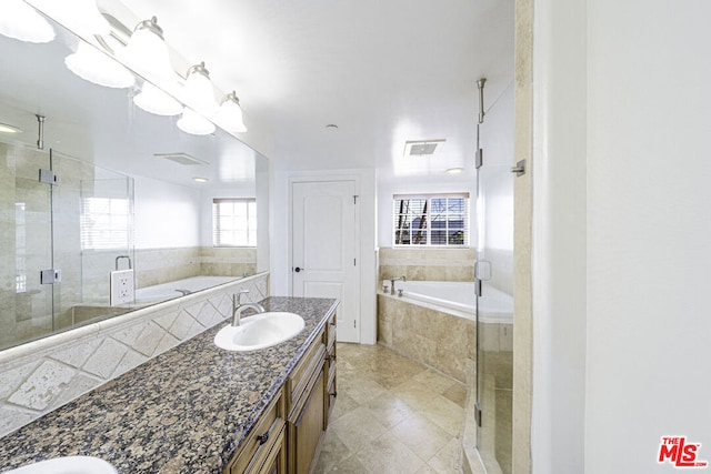 bathroom with vanity and plus walk in shower