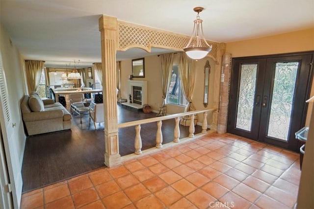 tiled foyer with a wealth of natural light and french doors