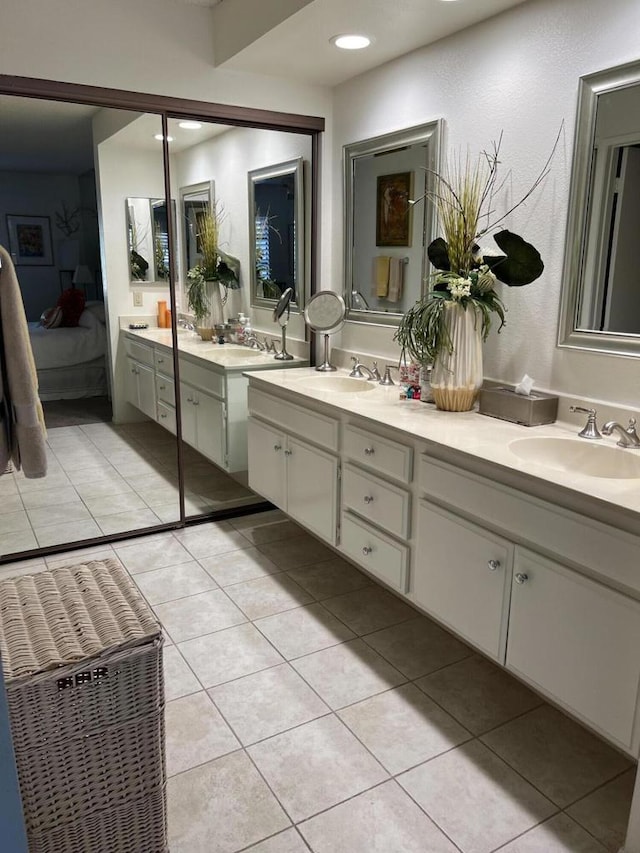 bathroom with tile patterned flooring and vanity