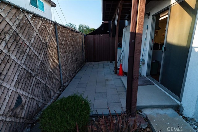 view of side of home with fence