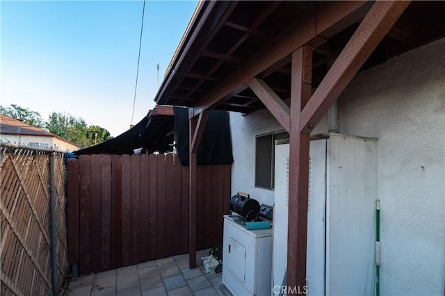 view of home's exterior with washer / dryer