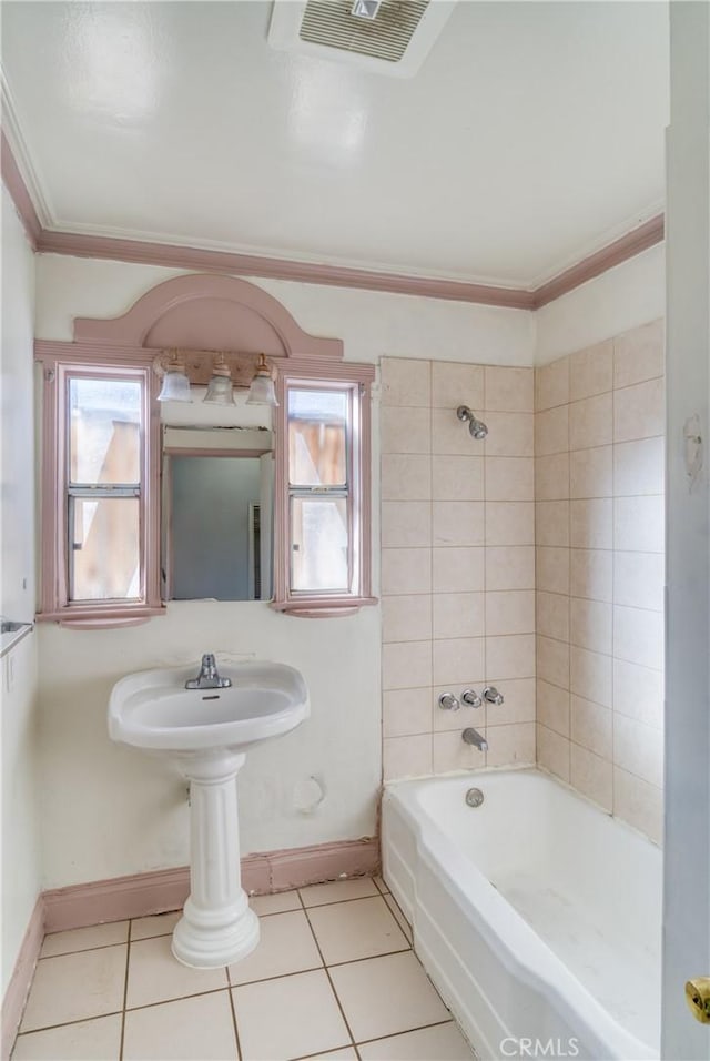 full bathroom featuring tile patterned flooring, visible vents, baseboards, and crown molding