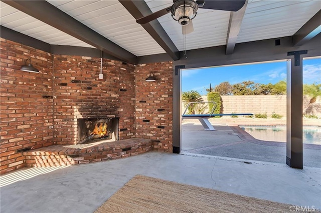 view of patio / terrace with an outdoor brick fireplace and ceiling fan