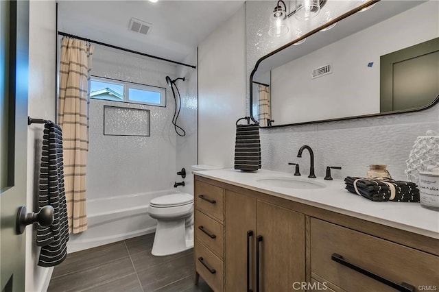 full bathroom with tile patterned floors, vanity, toilet, and shower / bathtub combination with curtain