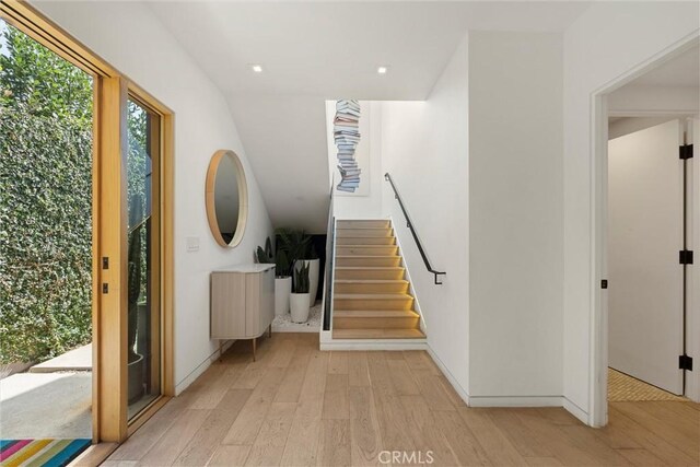 entryway with light hardwood / wood-style floors