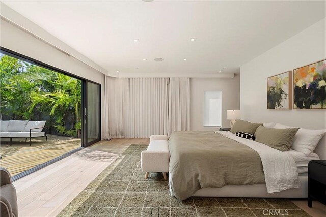 bedroom with hardwood / wood-style floors