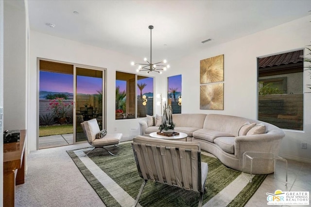 living room with an inviting chandelier