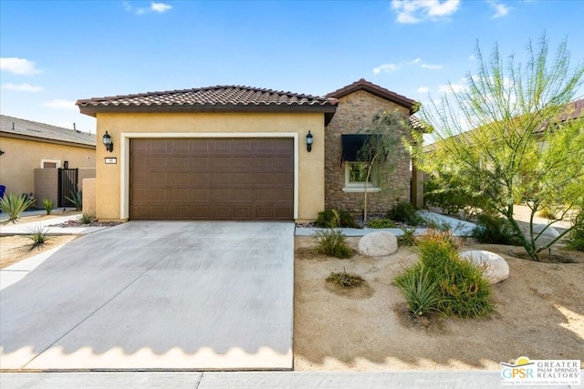 mediterranean / spanish home featuring a garage