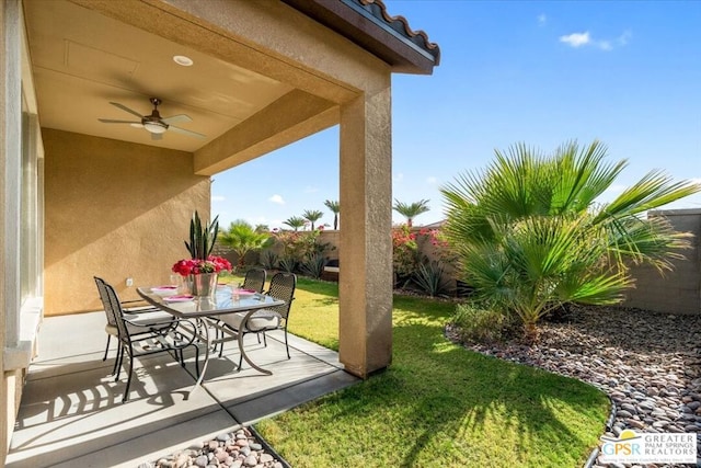 view of patio featuring ceiling fan