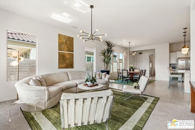 tiled living room with a chandelier