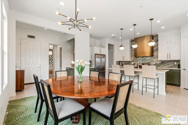 tiled dining space with a chandelier