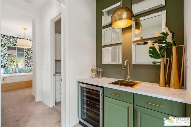 bar featuring light stone countertops, light colored carpet, sink, pendant lighting, and wine cooler