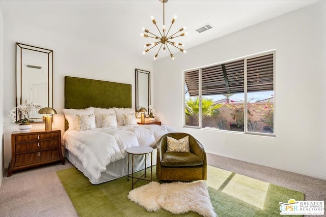 bedroom with carpet floors and an inviting chandelier