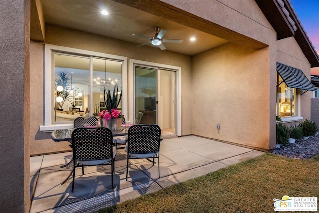 patio terrace at dusk with ceiling fan