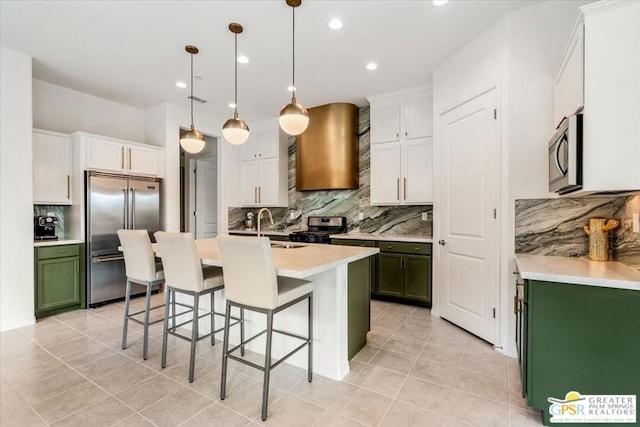 kitchen with a breakfast bar, backsplash, ventilation hood, hanging light fixtures, and stainless steel appliances