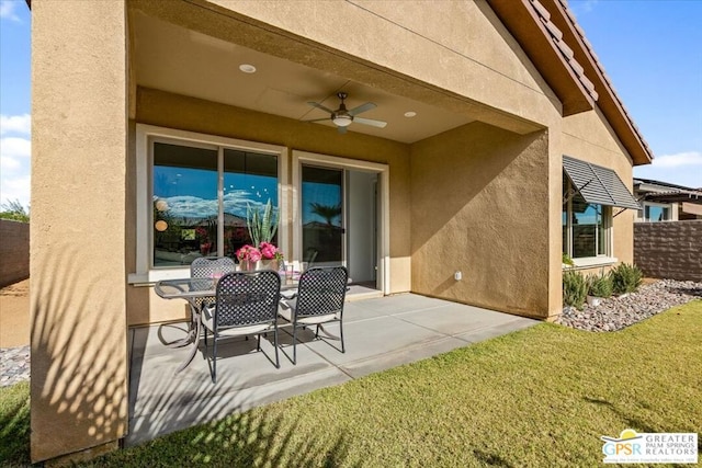 view of patio featuring ceiling fan