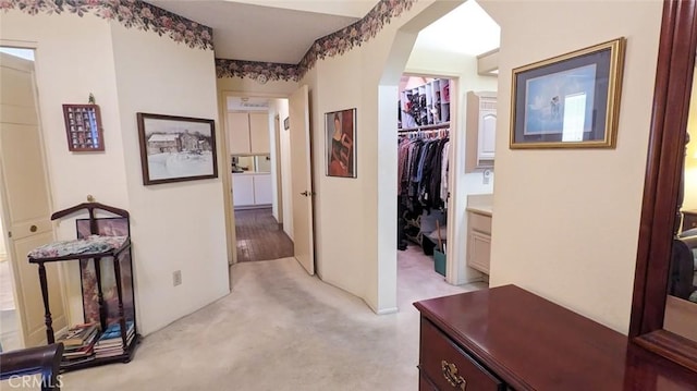 corridor with light colored carpet
