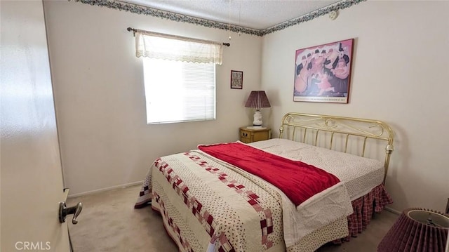 bedroom featuring light carpet