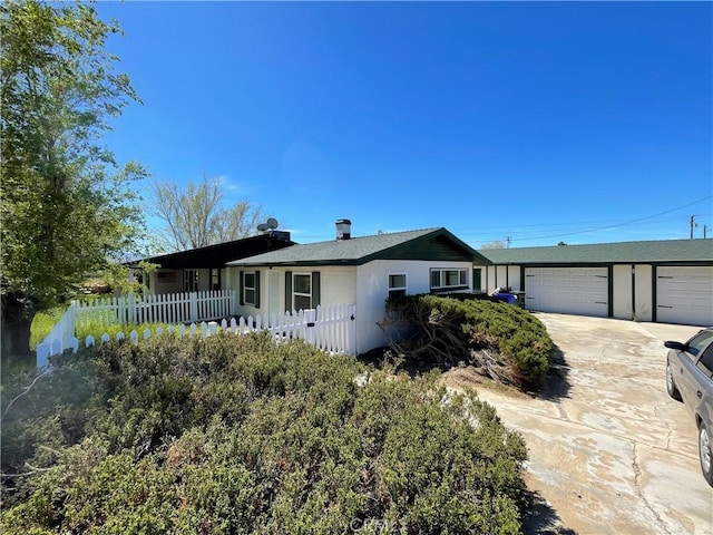 ranch-style home with a garage