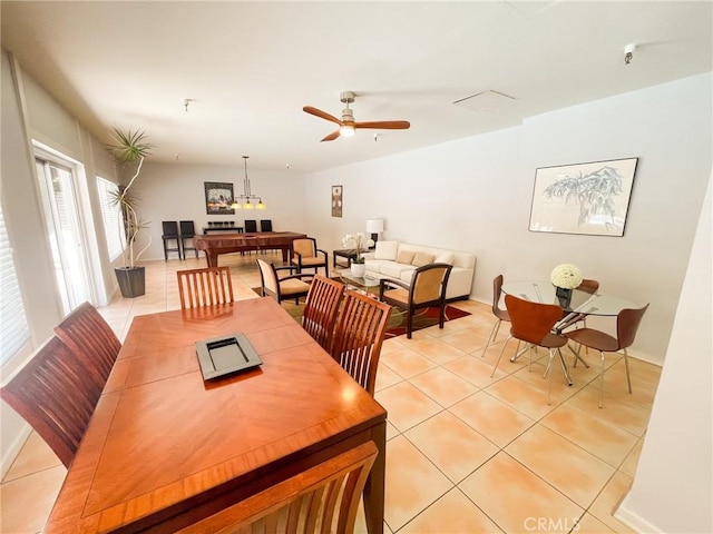 dining space with ceiling fan and light tile patterned floors