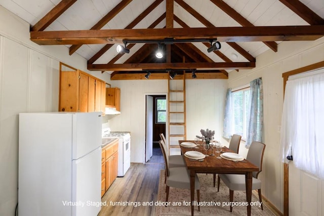 kitchen featuring dark hardwood / wood-style floors, lofted ceiling with beams, white appliances, and ventilation hood