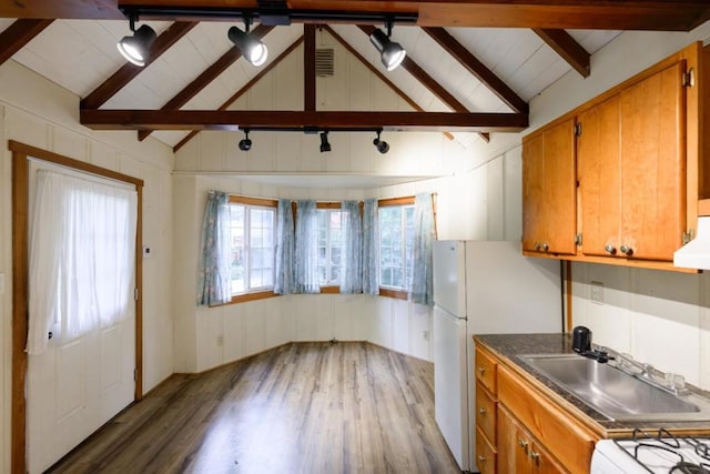 kitchen featuring beamed ceiling, white refrigerator, dark wood-type flooring, and sink