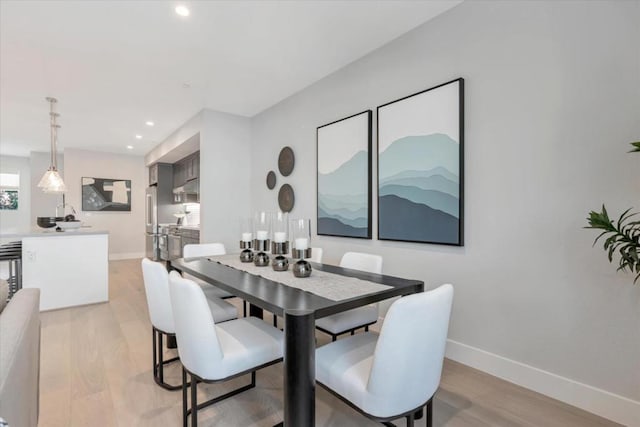 dining area with light hardwood / wood-style flooring