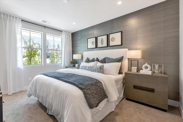 bedroom with light colored carpet