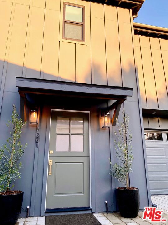 doorway to property featuring a garage