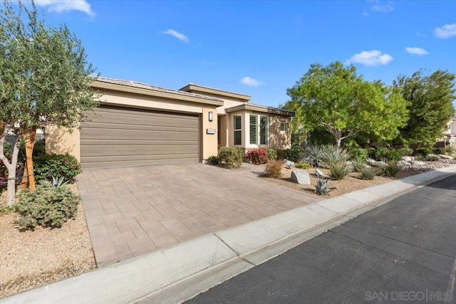 ranch-style house featuring a garage