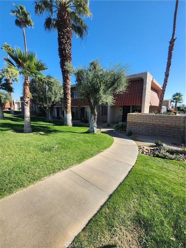 view of front of home featuring a front lawn and stucco siding