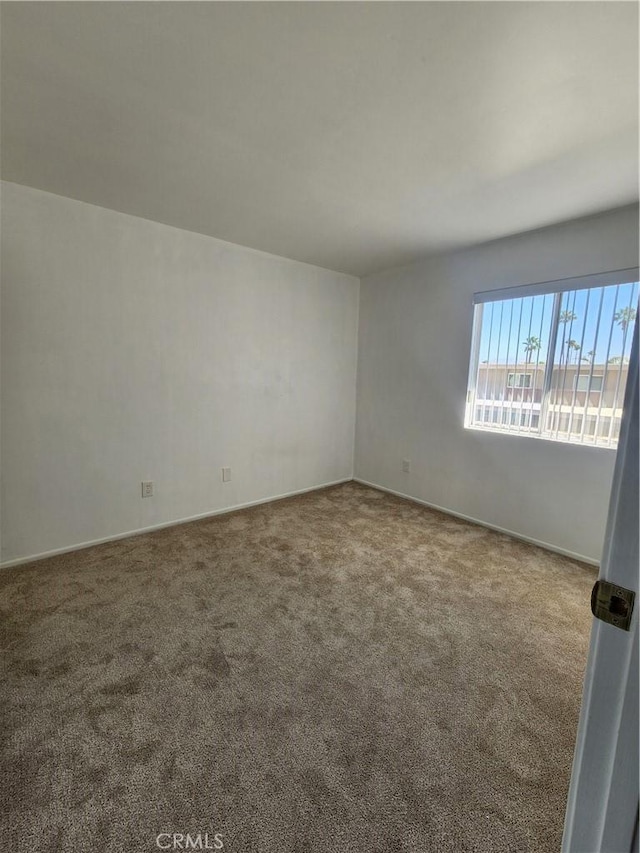 empty room with carpet flooring