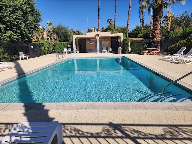 view of pool featuring a patio