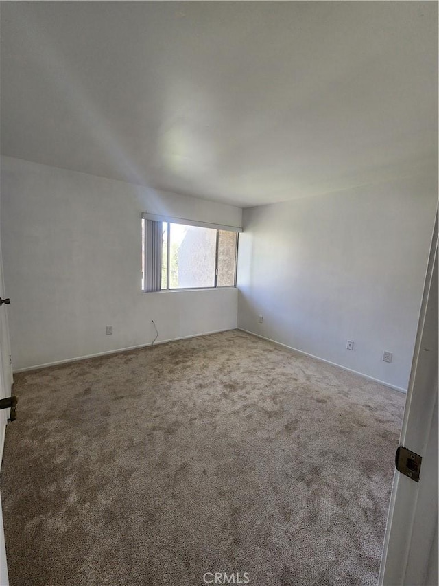 unfurnished room featuring carpet flooring