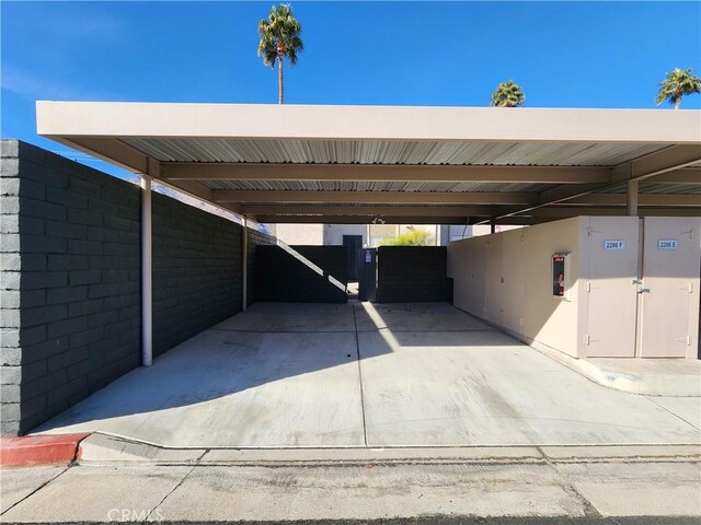 view of vehicle parking with a carport