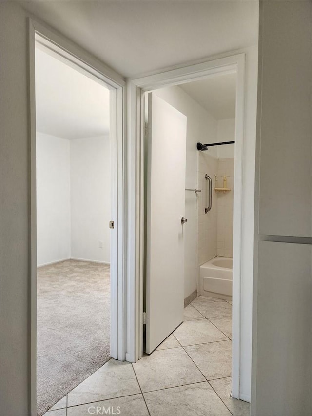 bathroom featuring bathtub / shower combination and tile patterned floors