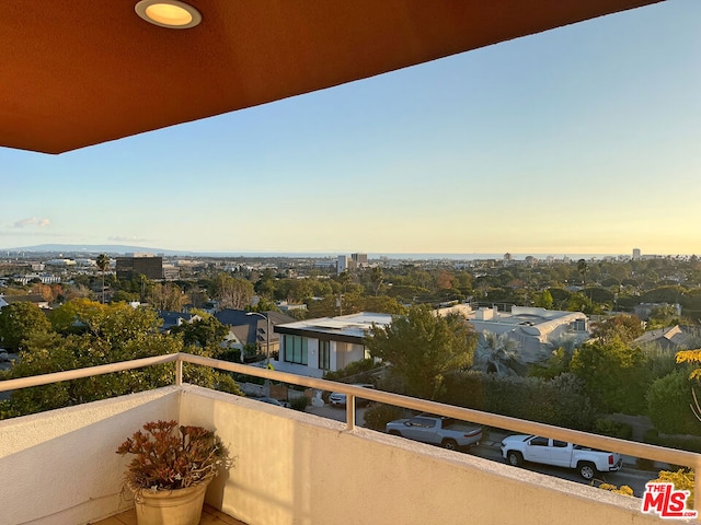 view of balcony at dusk